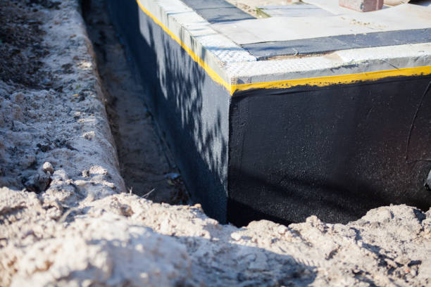 Professional Basement Waterproofing technician working in Mansfield, OH